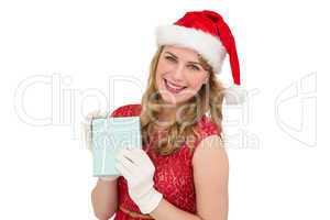 Smiling blonde in red dress wearing gloves and santa hat