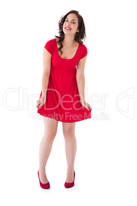 Stylish brunette in red dress