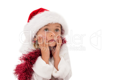 Cute little girl wearing santa hat and tinsel