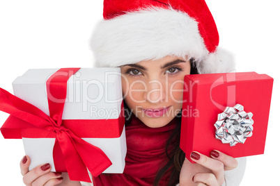 Pretty brunette showing christmas gifts