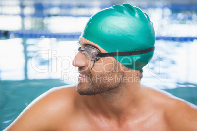 Close up of a fit swimmer in the pool