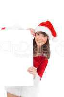 Cute santa girl holding poster
