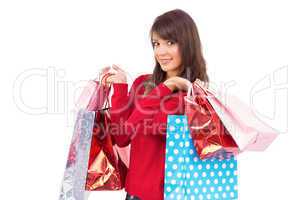 Smiling brunette holding shopping bags