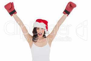 Festive brunette in boxing gloves cheering