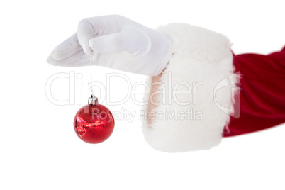 Santa claus holding red bauble