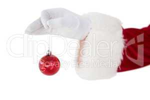 Santa claus holding red bauble