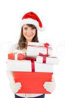 Attractive woman wearing santa hat with gifts