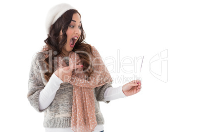 Astonished brunette in winter clothes