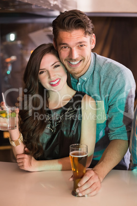 Young couple having a drink together