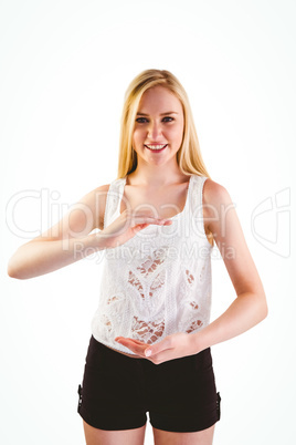 Pretty young blonde presenting with hands