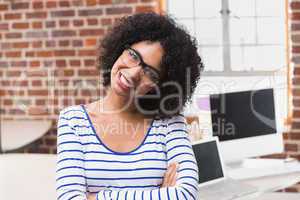 Smiling young businesswoman in office