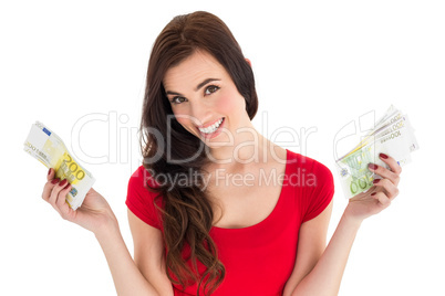 Cheerful brunette holding her cash money