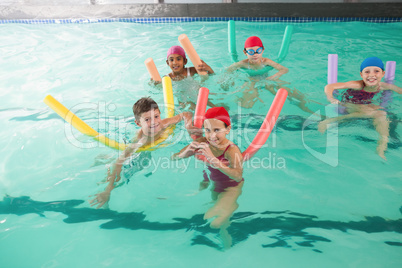 Cute little kids in the swimming pool