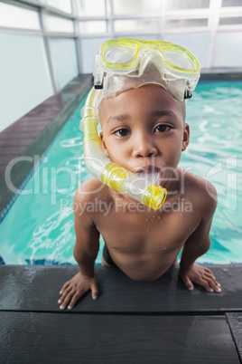 Cute little boy wearing snorkel and goggles