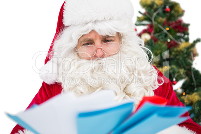 Father christmas showing many letters