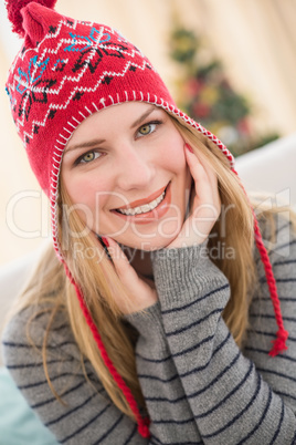 Portrait of a smiling pretty blonde in winter hat