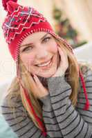 Portrait of a smiling pretty blonde in winter hat