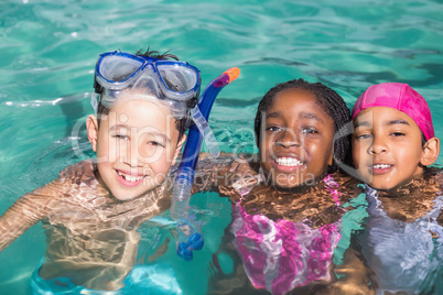 Cute little kids swimming in the pool