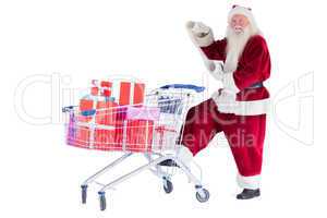 Santa pushes a shopping cart while reading