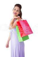 Elegant brunette posing with shopping bags