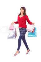 Excited brunette with shopping bags