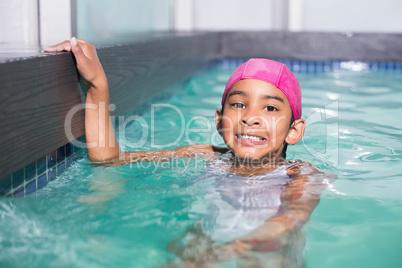 Cute kid swimming in the pool