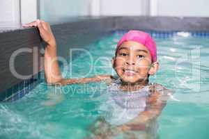 Cute kid swimming in the pool