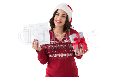 Brunette holding gift and sale sign