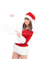 Pretty santa girl holding poster