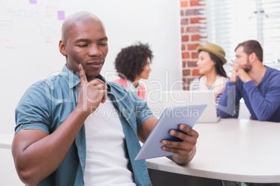 Man using digital tablet in business meeting