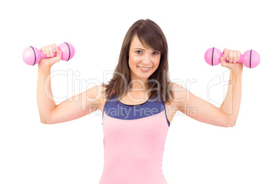 Smiling woman holding hand weight