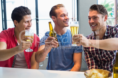 Young men drinking beer together
