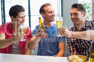 Young men drinking beer together