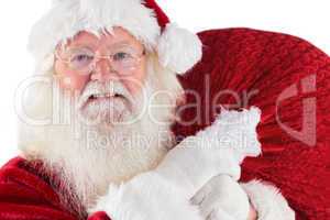 Jolly Santa carries his sack