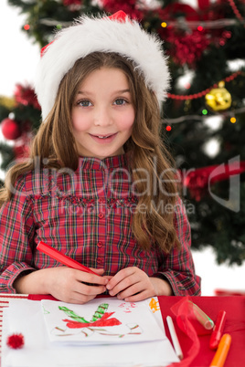 Festive little girl drawing pictures