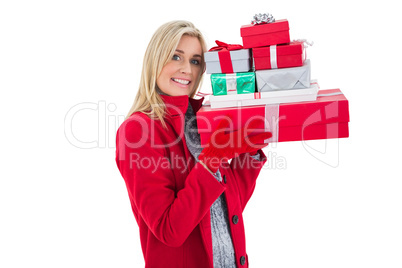 Festive blonde holding many gifts Festive blonde holding many gifts