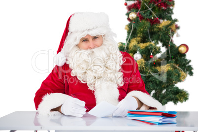 Portrait of father christmas writing list