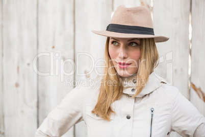 Blonde model posing with hand on hips while looking away