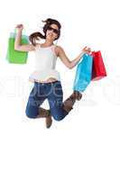 Happy brunette jumping with shopping bags
