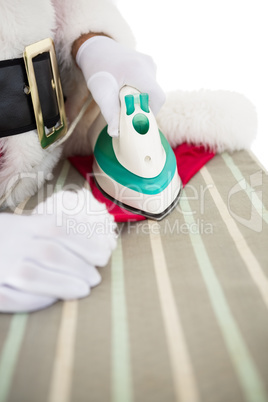 Santa claus ironing his hat