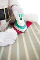 Santa claus ironing his hat