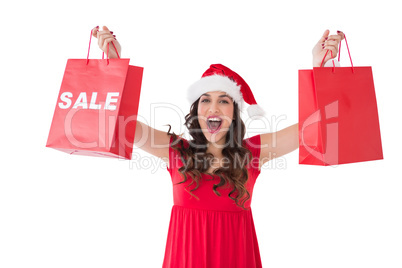 Brunette showing sale bag and shopping bag