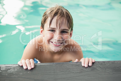 Little boy smiling in the pool