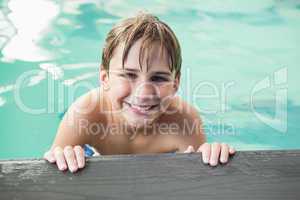 Little boy smiling in the pool