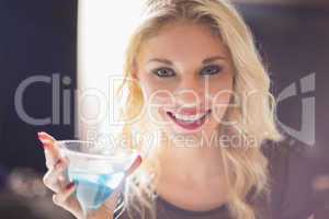 Attractive blonde drinking a cocktail