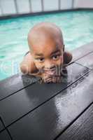 Little boy smiling in the pool