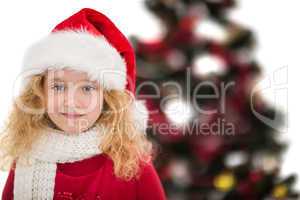 Festive little girl in santa hat and scarf