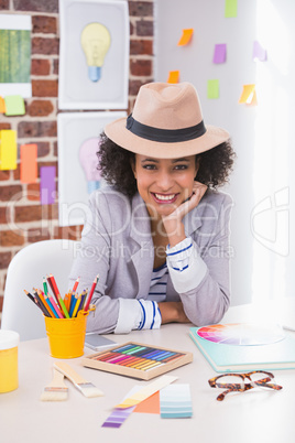 Portrait of female interior designer at desk