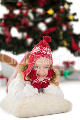 Festive little girl in hat and scarf