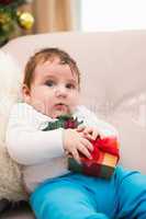 Cute baby boy on the couch at christmas